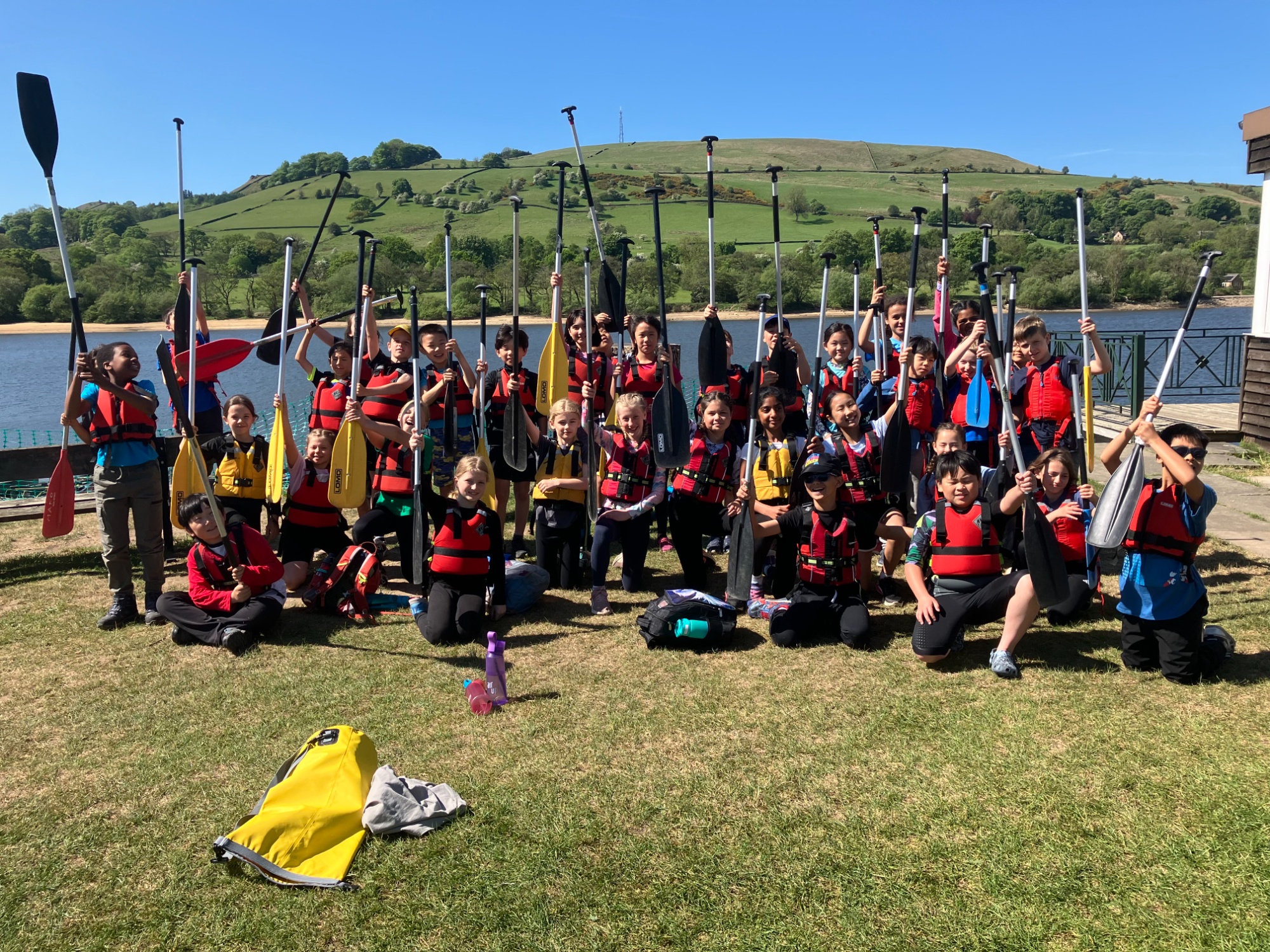 Year 5 students in the Peak District ready to sail rafts on the lake