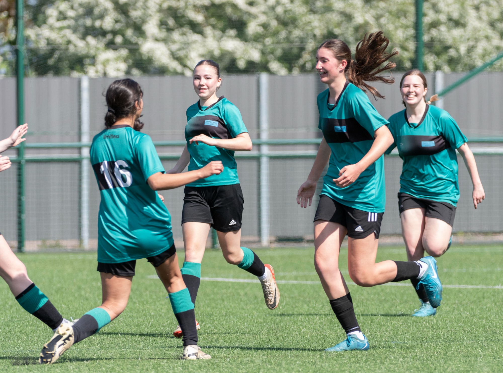 Stephen Perse Cambridge U15 girls' football team is celebrating  a goal