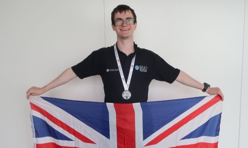 Student George D with his World Silver Medal from the International Olympiad on Astronomy and Astrophysics
